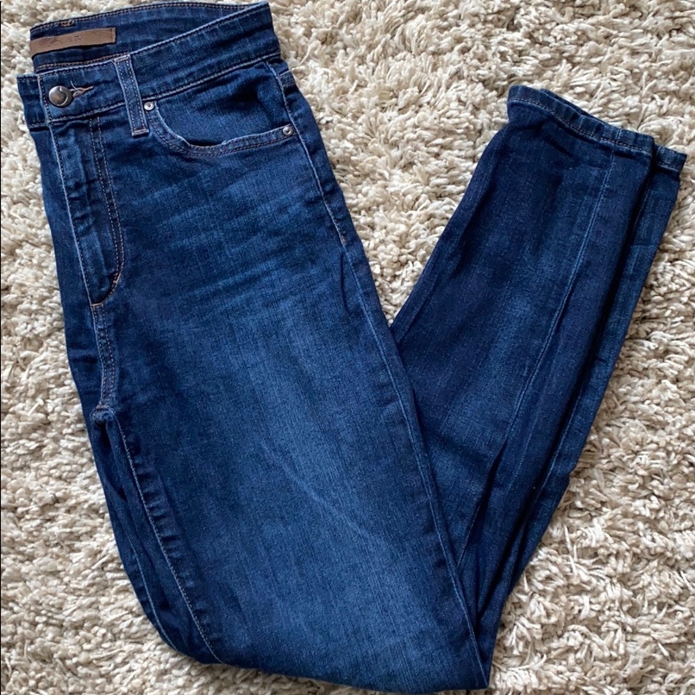 Skinny jeans with rips on knees. Dark blue.